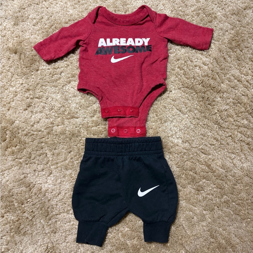 Nike Newborn “Already Awesome” Red Bodysuit & Black Sweatpants Set